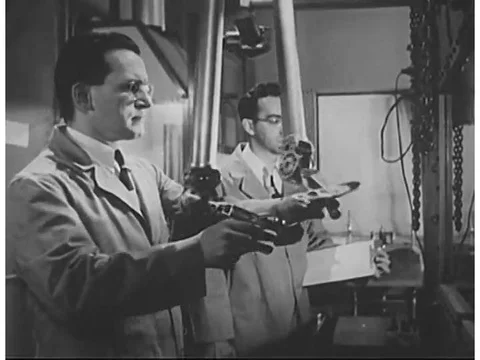 Scientists use remote control devices to work with radioactive materials, and Stock Footage 75082904