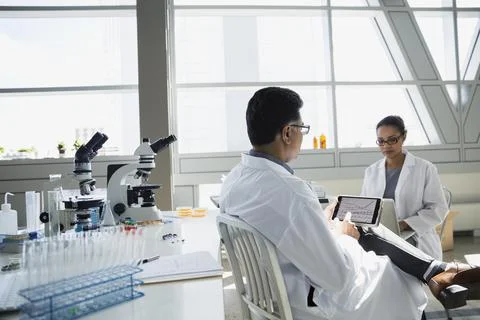 Scientists using digital tablet in laboratory Stock Photos