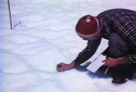 Scientists using instruments to study glaciers. Stock Footage 122212123