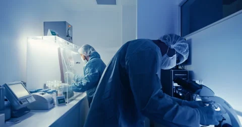 Scientists Using Microscope in Laboratory Stock Footage 305345700