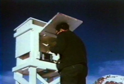 Scientists using weather instruments at research station on a glacier. Stock Footage 122211904