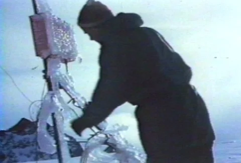 Scientists using weather instruments at research station during winter. Stock Footage 122211986