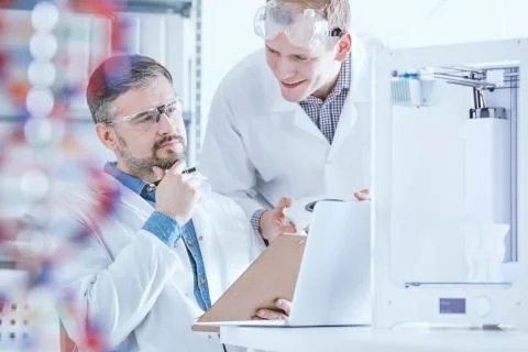 Scientists wearing white uniform Stock Photos