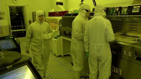 Scientists work in a clean laboratory developing high tech materials. 動画素材 123369695
