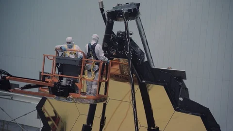 Scientists work on James Webb Space Telescope in space center Stock Footage 97870206