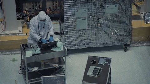 Scientists work on James Webb Space Telescope in space center Stock Footage 97870407