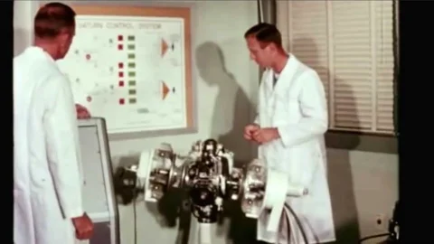 Scientists work on the Saturn rocket guidance system and computations are made Stock Footage 90094714