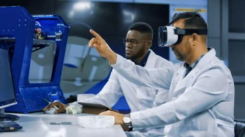Scientists working with 3d printing and VR Stock Photos
