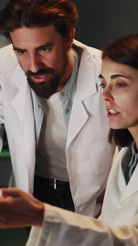 Scientists working on computer in laboratory at night Stock Footage 316792718