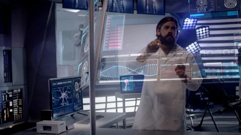 Scientists working on EEG Headset technology with female patient. Stock Footage 119788831