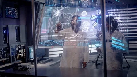 Scientists working on EEG Headset technology with female patient. Stock Footage 119831687