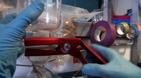 Scientists working in a laboratory. filtering liquid Stock Footage 46357059