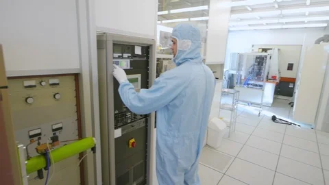 Scientists Working In A Semiconductor Cleanroom Facility Stock Footage 92864461