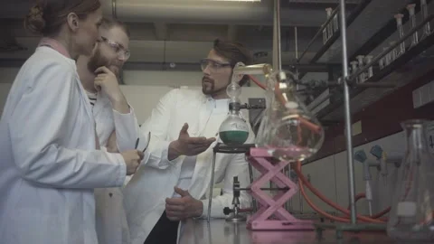 Scientists working as a team in the laboratory Stock Footage 141938798