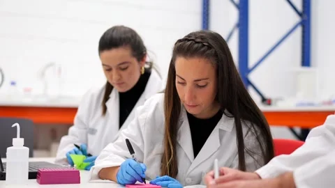 Scientists working together in a laboratory Video stock 255196251
