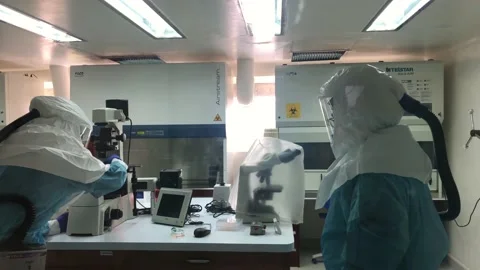 Scientists working on in vitro deadly coronavirus cultive Stock Footage 158448947