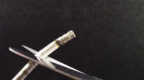 Scissor cut cigarette Video stock 52679648