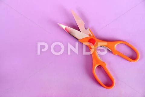 Scissor on a paper background Stock Photos