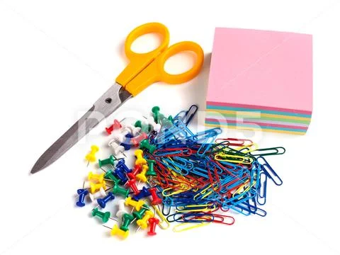 Scissor, tacks, papers and paper clips on white background Stock Photos