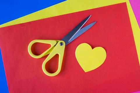Scissors and colored paper Stock Photos