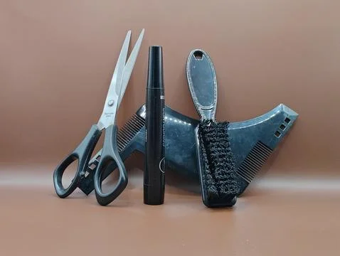 Scissors and a comb are various tools for a stylist's work. Stock Photos
