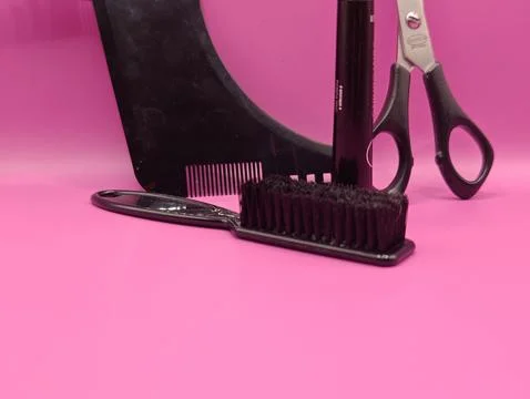 Scissors and a comb are various tools for a hair stylist's work. Stock Photos