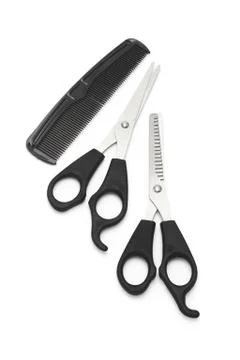 Scissors and comb Stock Photos