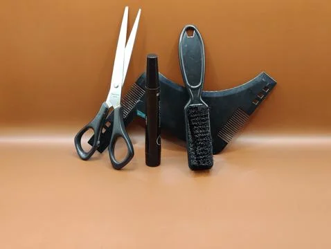 Scissors and a comb Stock Photos