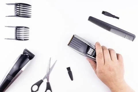 Scissors and combs on white Stock Photos