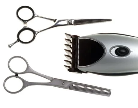 Scissors and the machine for a hairstyle Stock Photos