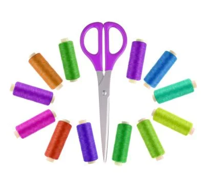 Scissors and multicolor sewing threads  isolated on white background Photos