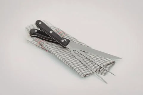 Scissors and needle threader on fabric Stock Photos