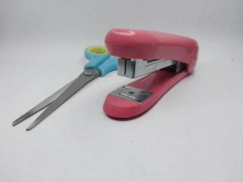 A scissors and stapler Stock Photos