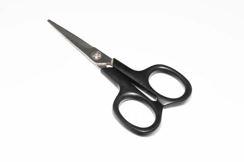 Scissors with a black handle on a white background Stock Photos