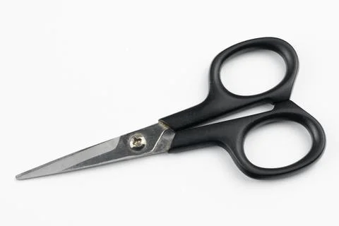 Scissors with a black handle on a white background Stock Photos