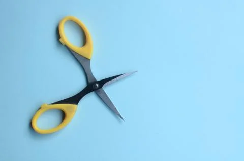 Scissors with blank space on a blue background. top view Stock Photos