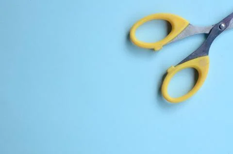 Scissors with blank space on a blue background. top view Stock Photos