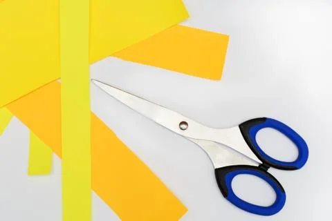 Scissors with blue handles on the white 库存照片