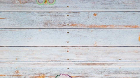 Scissors, cottons , pins and buttons moving on wooden table - Stop motion Stock-Footage 128933435