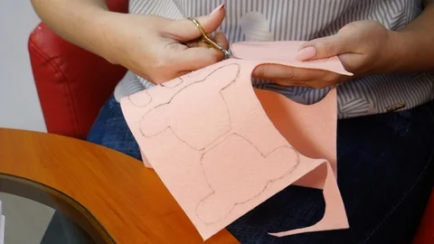 Scissors cut a figure from a fabric Stock Footage 115522985