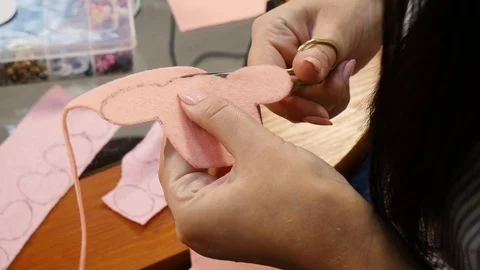 Scissors cut a figure from a fabric Stock Footage 115522989