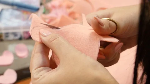Scissors cut a figure from a fabric Stock Footage 115522991
