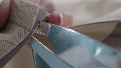 Scissors cut thread from fabric after sewing Stock Footage 231015097