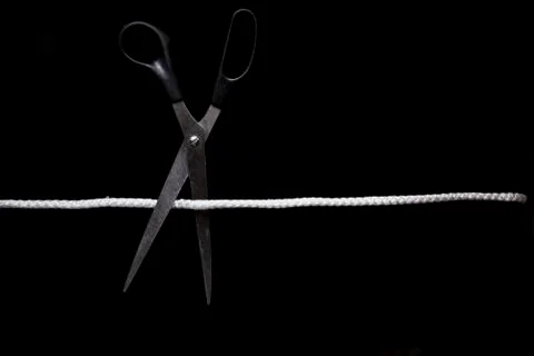 Scissors cut the thread Stock Photos