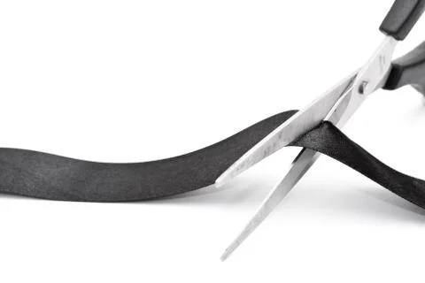 Scissors cutting black ribbon Stock Photos