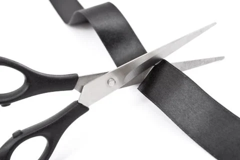 Scissors cutting black ribbon Stock Photos