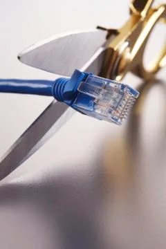 Scissors cutting network cable Stock Photos