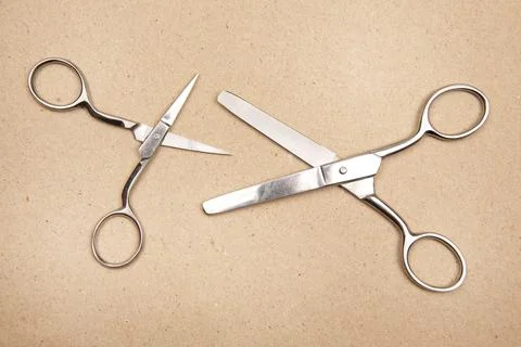 Scissors for cutting on paper background Stock Photos