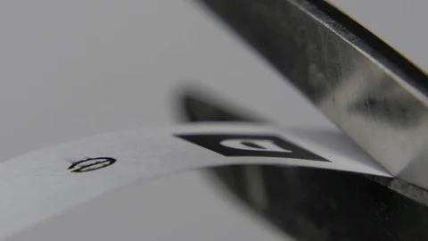 Scissors Cutting Paper with Letters Stock Footage 74249706