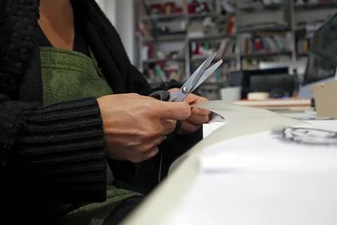Scissors cutting paper Stock Photos